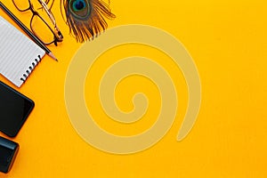 Creative Wallpaper with some stationary items on a yellow background.