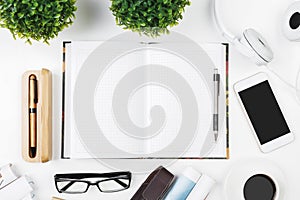 Creative white table with empty smartphone