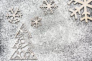Creative winter snowflakes and fir-tree from powdered sugar Christmas and New Year backgrounds.