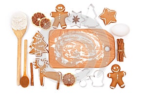 Creative winter time baking background. Kitchen utensils and ingredients for christmas homemade gingerbread cookies