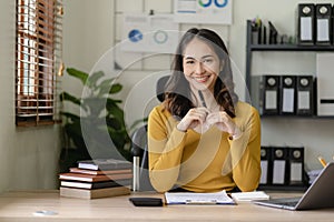 creative women's online desk using laptop computer licensing space Successful Asian businesswoman