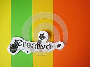 Creative word cut from paper