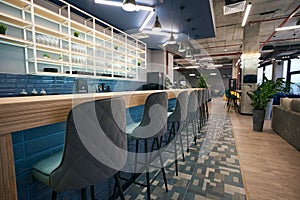 Creative zoning in coworking space, stylish bar area, clean empty space photo