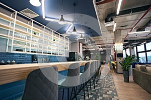 Creative zoning in a modern coworking space, stylish bar area photo