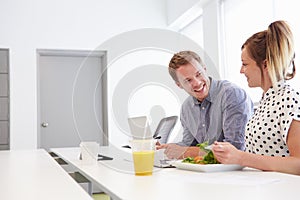 Creatives Having Working Lunch In Design Studio