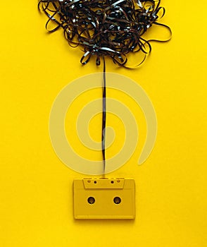 Creativity Design Concept. Retro audio tape On Yellow Background, Top View