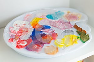 Creativity, drawing and hobbies - palette with colorful paints