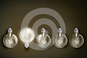 Creativity innovation illuminated light bulb row dim ones concept solution