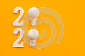 2020 creativity inspiration concepts with text nuber and lightbulb on color background