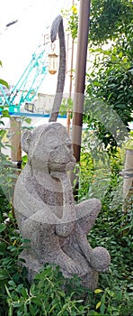 Creativity of Monkey Statues from Stone.  Monkeys are a symbol of intelligence, cheerfulness and adaptability. photo