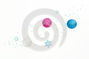Creativity New Year composition. Christmas balls and blue decorations on white background. Flat lay, top view