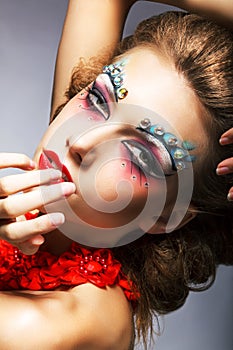 Creativity. Shiny Woman Actress with Bright Make Up. Glamor photo