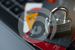 Credit bank cards with a lock on the keyboard. Online shopping, online security. Hacking a bank account