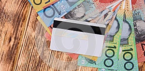 credit card with Australian dollars on the table