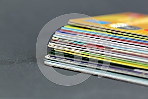 Stack of credit plastic cards on a black background