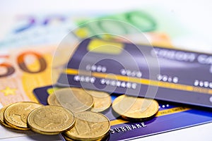 Credit card with coins and Euro banknotes : Financial development, Accounting, Statistics, Investment Analytic research data.