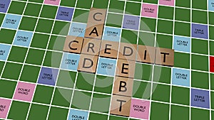 Credit card debt crossword on fake scrabble board photo