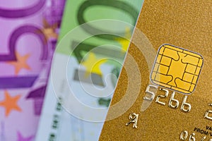 Credit card and euro banknotes