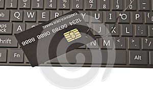 Credit card on fishing hook and laptop computer keyboard.3D illustration.