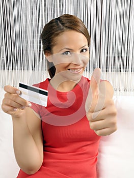 Credit card holding young women photo