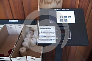 Credit card payment terminal in a church to buy candles or make a donation