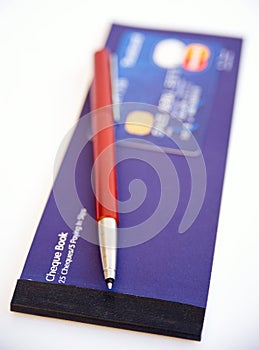 Credit card, pen and cheque book.