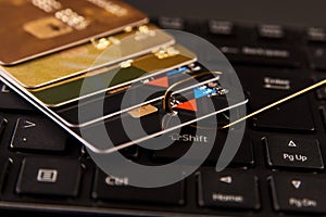 Credit card phishing attack over dark background, close-up