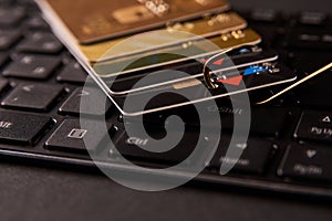 Credit card phishing attack over dark background, close-up