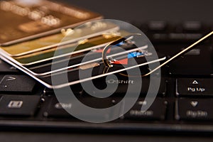 Credit card phishing attack over dark background, close-up