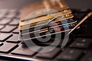 Credit card phishing attack over dark background, close-up