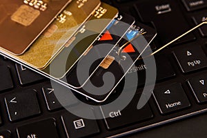 Credit card phishing attack over dark background, close-up