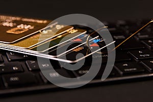 Credit card phishing attack over dark background, close-up