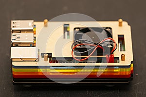 Credit-card-sized single-board microcomputer with connected to gpio slot fan connector photo