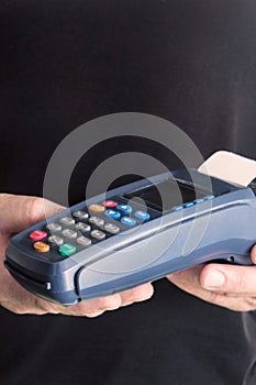 Credit card swipe through terminal for sale in store. Shopping and retail concept