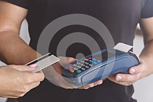 Credit card swipe through terminal for sale in store. Shopping and retail concept