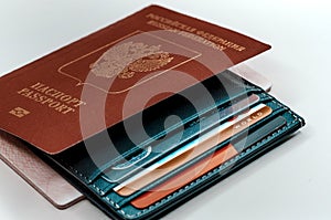 A credit cardholder next to a foreign passport. Payment of tickets for travel