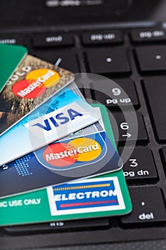 Credit cards on black computer keyboard