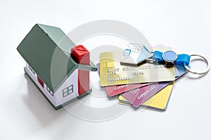Credit cards concept mortgag for new home on white background
