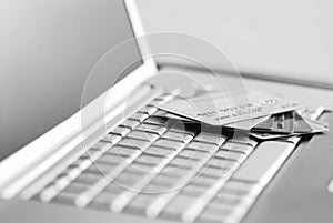 Credit cards on a laptop keyboard.