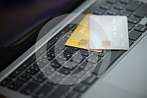 Credit cards on the laptop keyboard. Open access for online shopping, Credit card close up shot with selective focus, Concept of