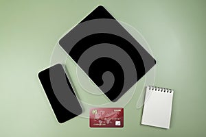 Credit cards and tablets with mobile phones with empty screens for mobile payment, banking, or online shopping
