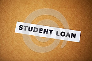 Credit concept. Student loan written on white card