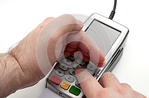 Credit and debit card payments, financial privacy and bank data security concept with hand used as a shield while entering the PIN