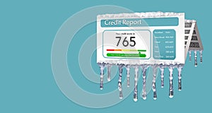 A credit freeze, or freeze on your credit report is represented with icicles and snow on a mock credit report isolated on the back photo
