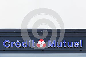 Credit mutuel logo on a wall