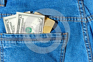 Credit plastic card with dollar cash in jeans pocket