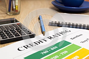 Credit rating chart with pen and calculator