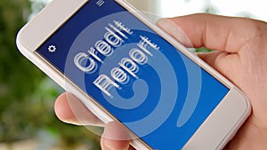 Credit Report concept application on the smartphone. Man uses mobile app.