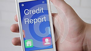 Credit report concept application on the smartphone. Man uses mobile app.