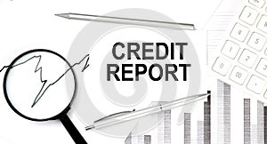 CREDIT REPORT document with pen,graph and magnifier,calculator,business concept